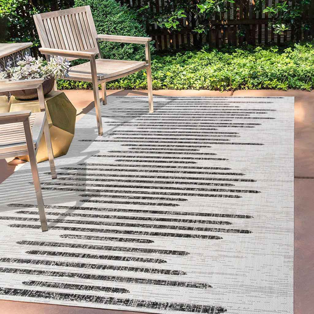 6' X 9' Ivory And Black Striped Indoor Outdoor Area Rug