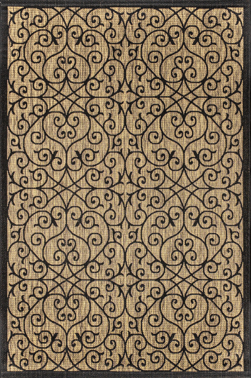 Geometric area rug close-up with black ornate scroll pattern on khaki base