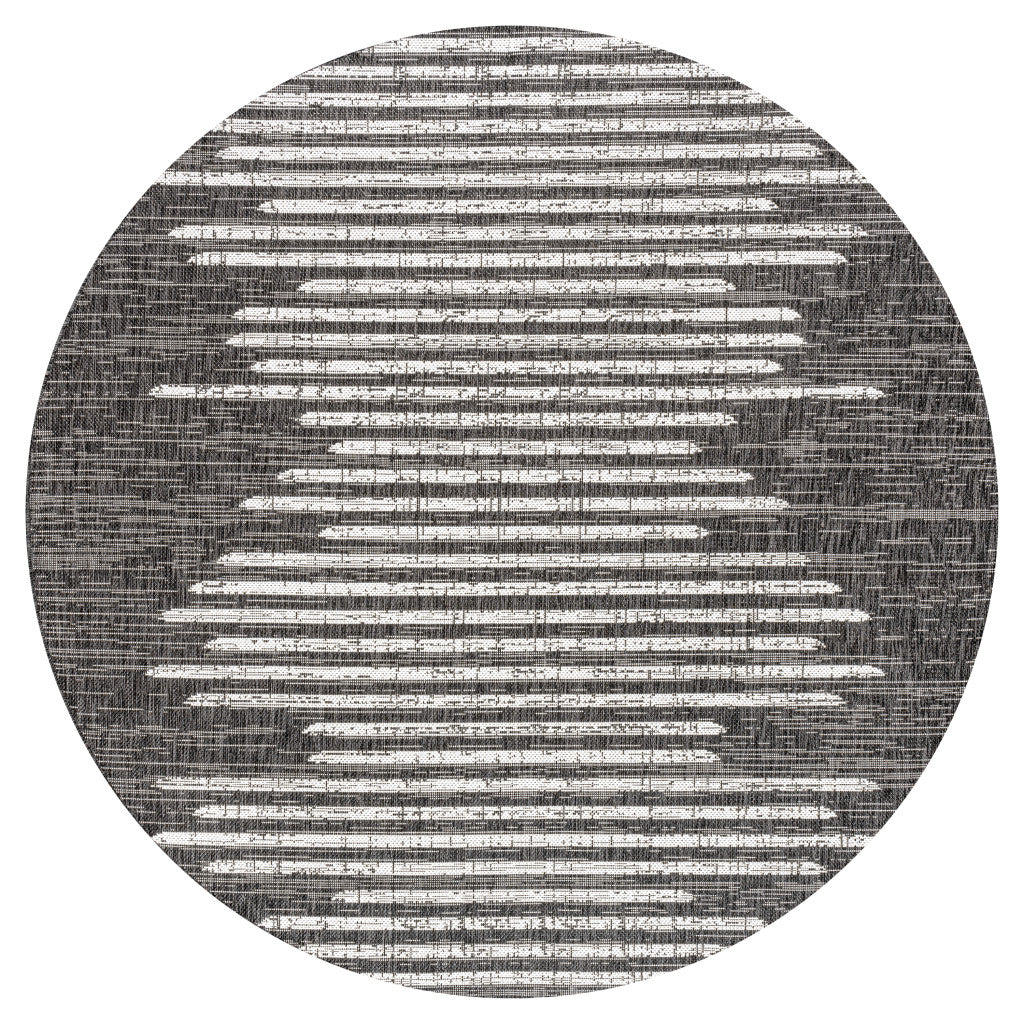 Round black rug with ivory horizontal stripe pattern, centered top view