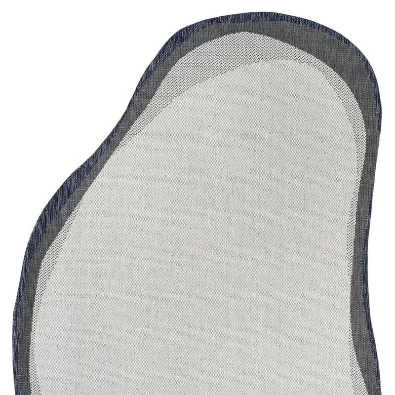 Cream abstract rug surface with navy-and-gray layered border
