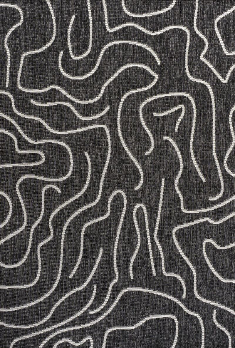 Black area rug with cream wavy contour lines, abstract pattern close-up