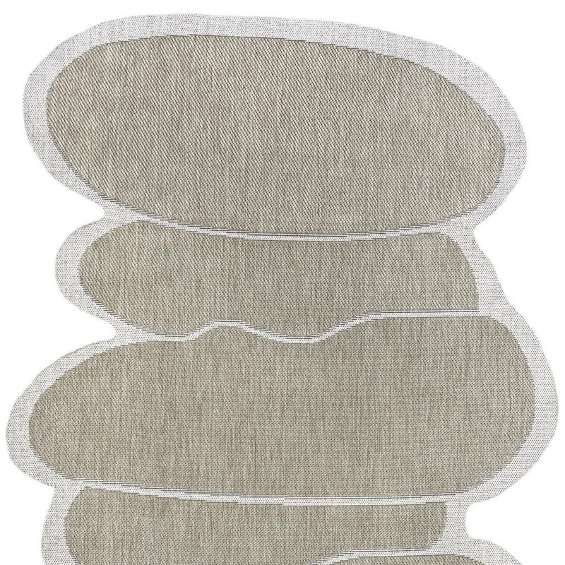 Indoor outdoor area rug with layered oval medallion pattern, beige and cream tones