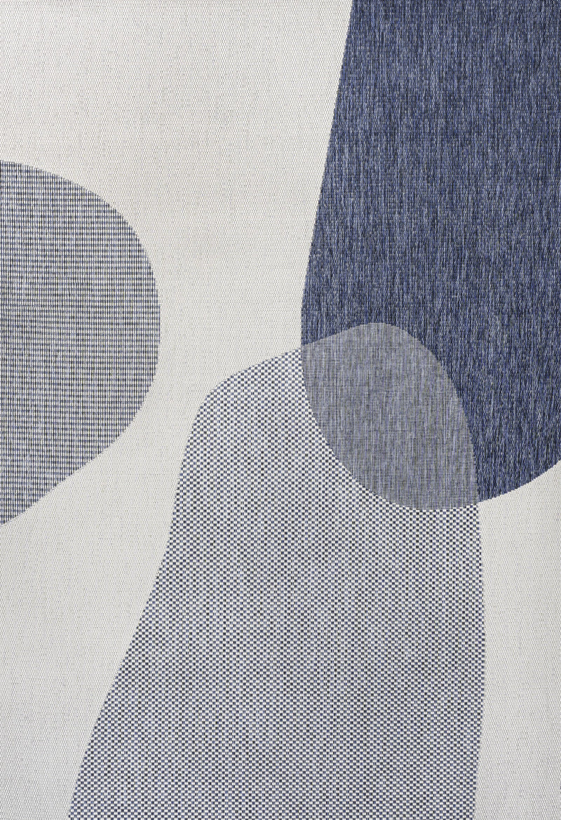 Cream and navy geometric area rug close-up of overlapping ovals in textured fabric