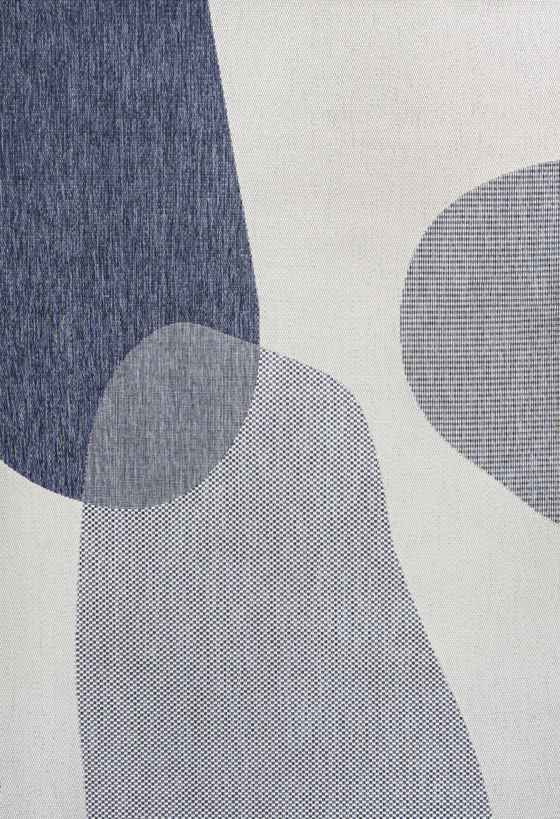 Cream and navy geometric area rug close-up of abstract ovals on textured weave