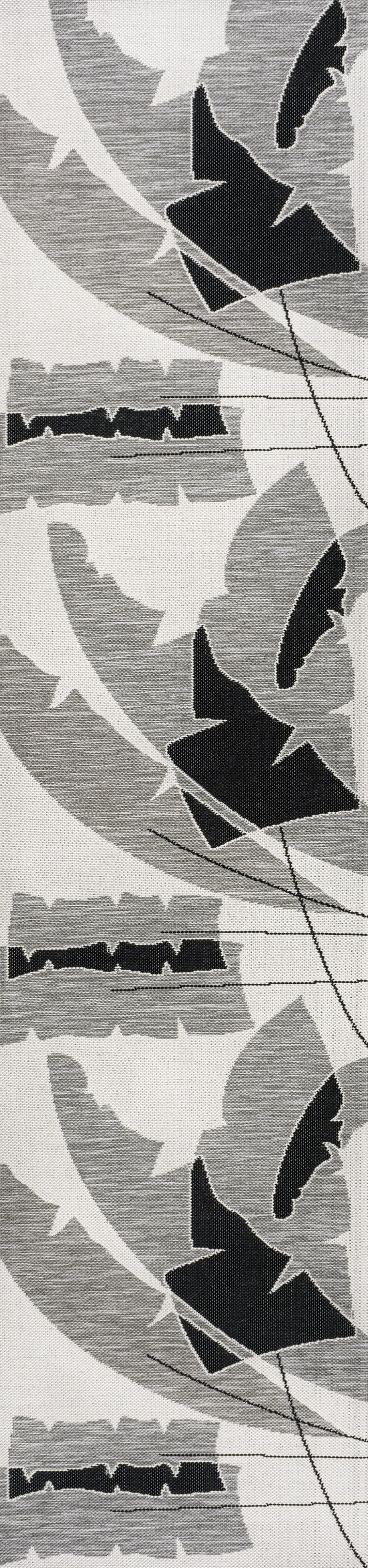 Gray and cream abstract bird-like motif runner rug, close-up pattern