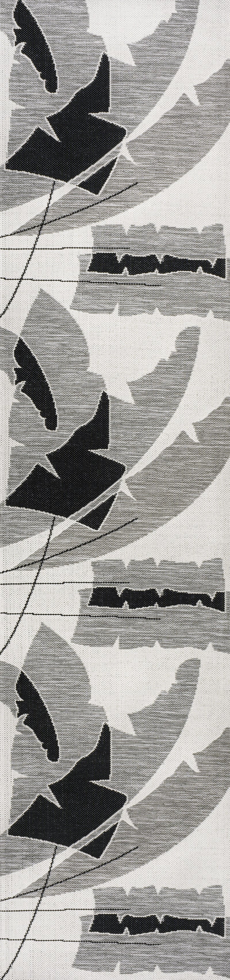 Gray and cream abstract bird-like motif runner rug, tight pattern close-up