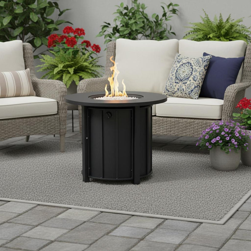 Black round propane fire pit with flames rising from center burner