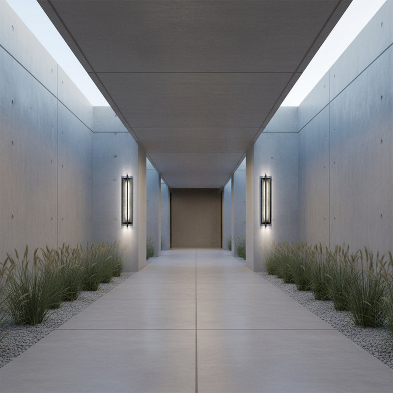 Two black LED outdoor wall lights flanking a walkway, speckled glass panels