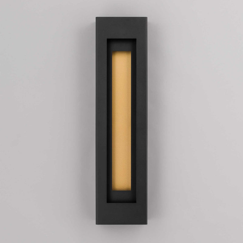 Black outdoor wall sconce with vertical rectangular opening and glowing LED tube