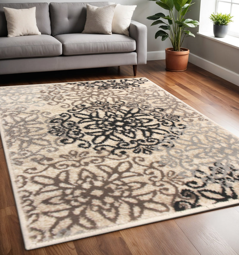 5' X 8' Beige Black And Brown Floral Medallion Area Rug - Home Decor