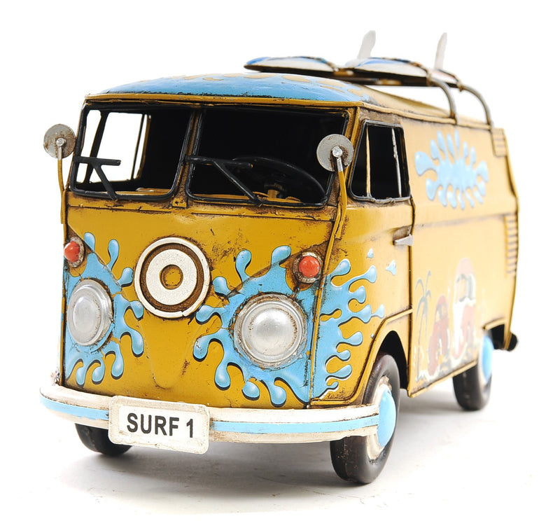 Yellow hand-painted metal van model in three-quarter front view with SURF 1 plate.