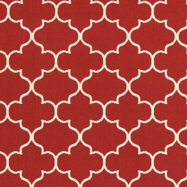 Red and ivory indoor/outdoor area rug with repeating quatrefoil trellis pattern