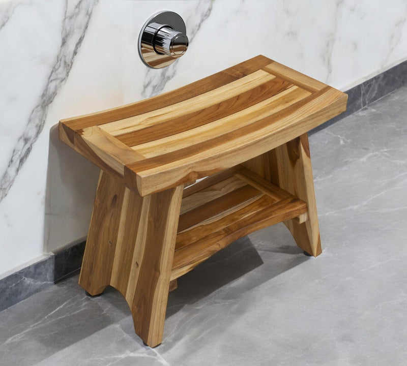 Natural teak shower bench with shelf, angled view showing lower storage platform