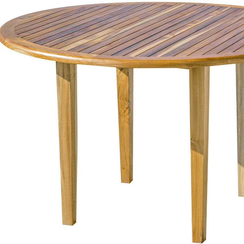 Round natural wood outdoor dining table with dark slatted tabletop and legs