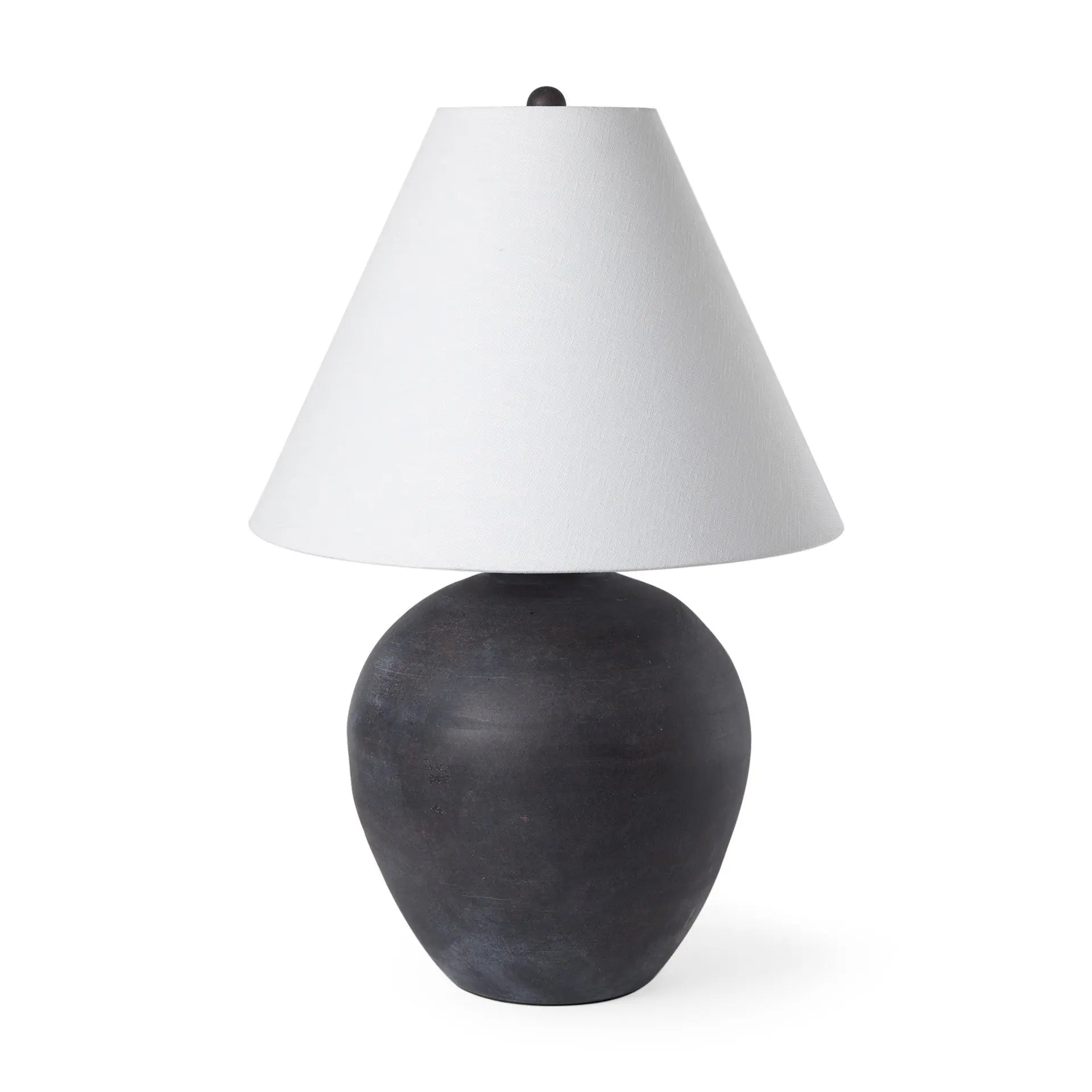 Black ceramic lamp with a textured finish and a white fabric cone shade. Elegant and modern design for home decor.