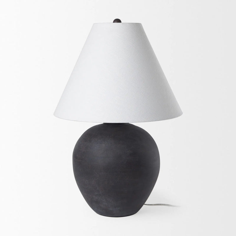 Black ceramic table lamp with a white fabric shade, featuring a modern, minimalist design.