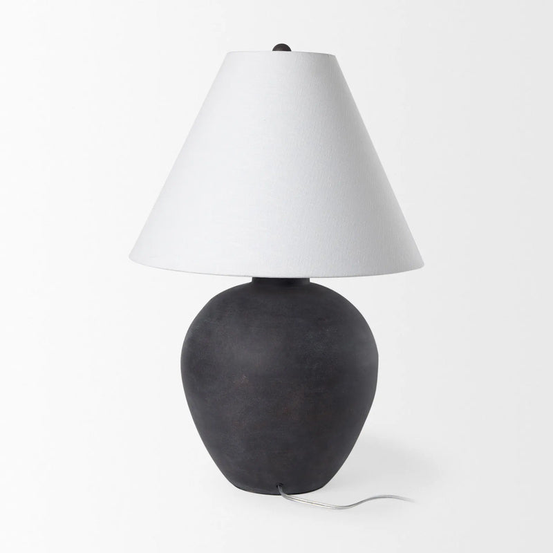 Black ceramic table lamp with a white fabric shade, featuring a contemporary vase silhouette.