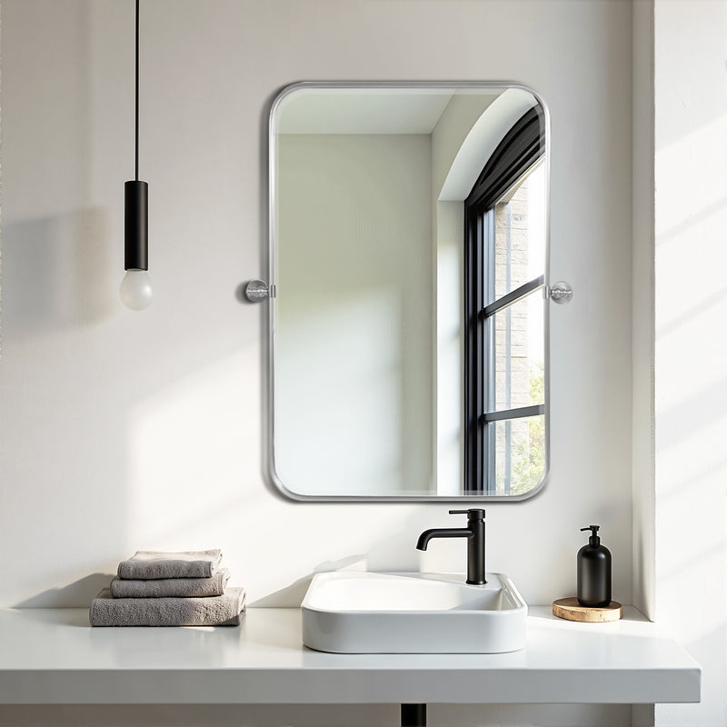 Wall-mounted bathroom vanity mirror with rounded-rectangle shape and light metal frame