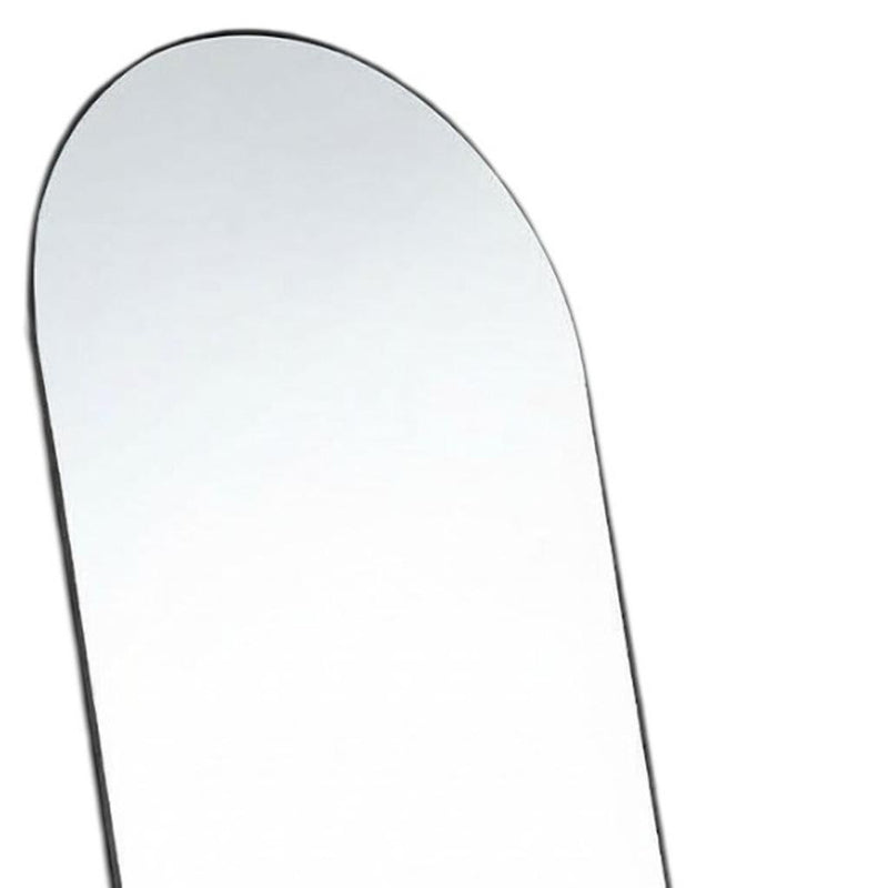 Rounded arched mirror corner with thin black frame around reflective glass