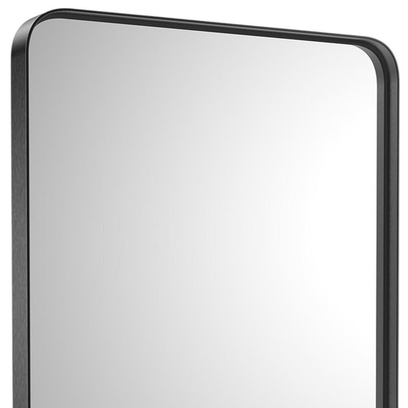 Close-up of black metal framed bathroom mirror with rounded corners