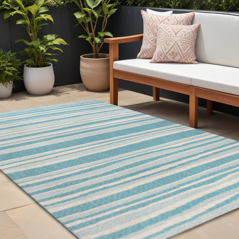 Outdoor area rug with aqua and cream horizontal stripes, rectangular