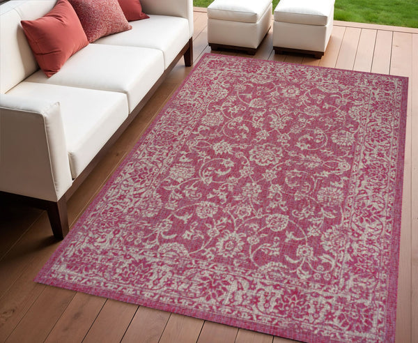 Fuchsia and light gray medallion indoor/outdoor area rug with ornate pattern