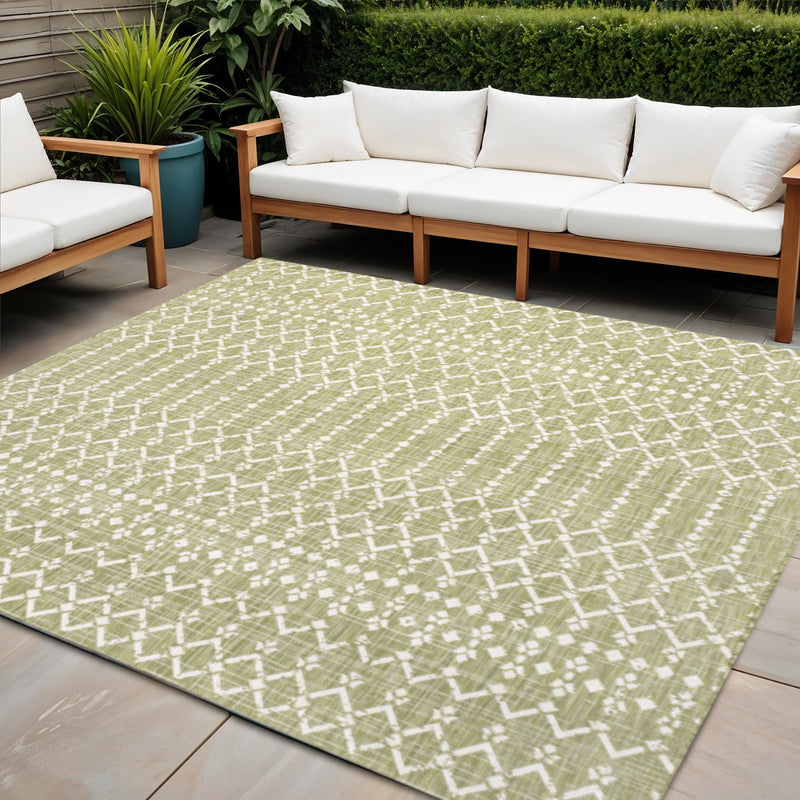 Outdoor light green area rug with cream square trellis pattern in a seating area