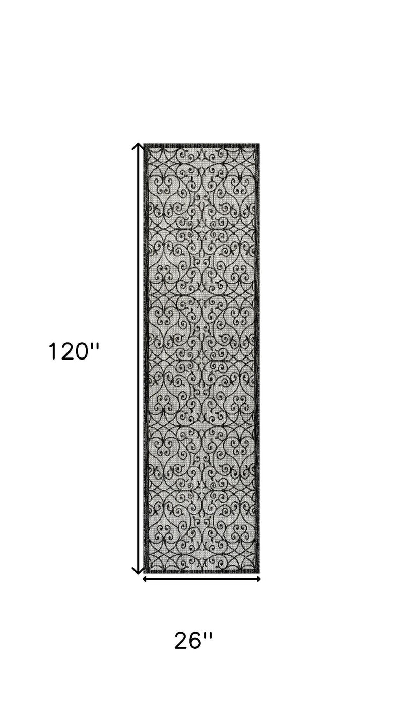 Light gray and black geometric runner rug, 120 in by 26 in, border detail