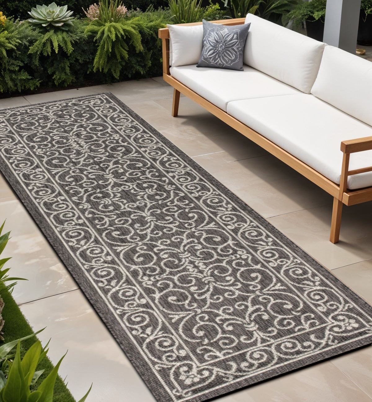 Black and gray medallion runner rug with ornate scrolling pattern, indoor/outdoor