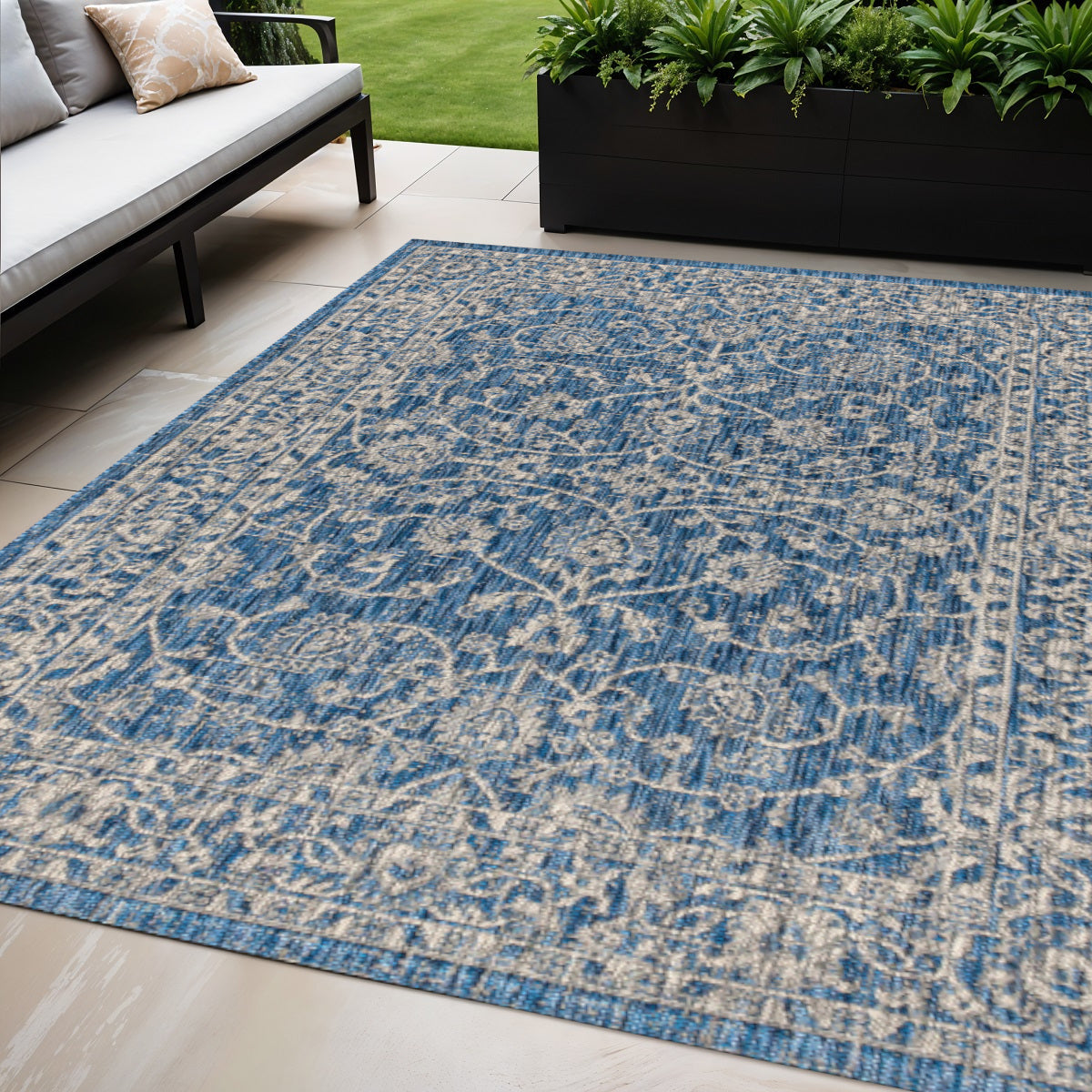 Navy and gray medallion indoor/outdoor area rug with ornate flat-weave pattern