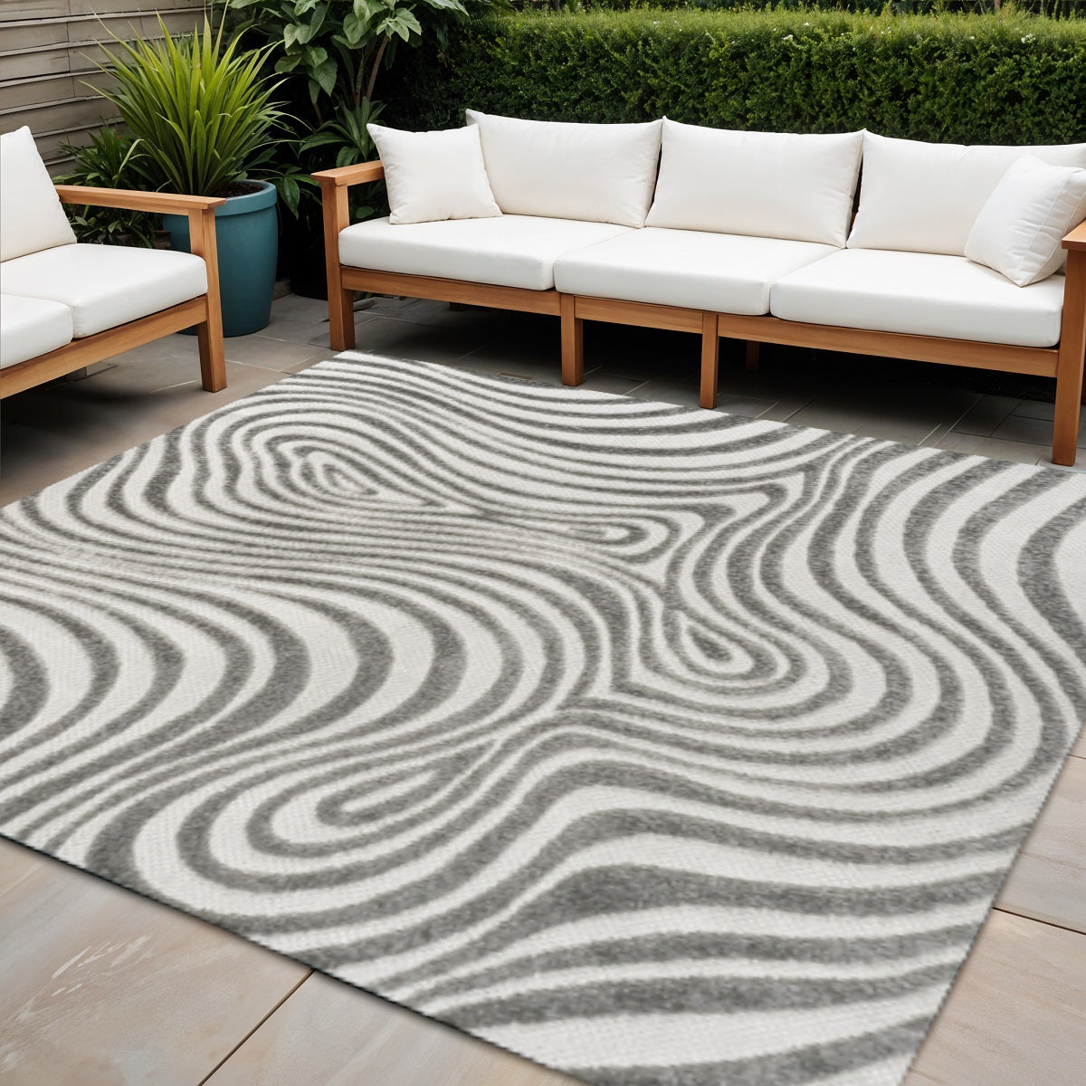 Gray and ivory square outdoor-ready area rug with abstract swirl pattern