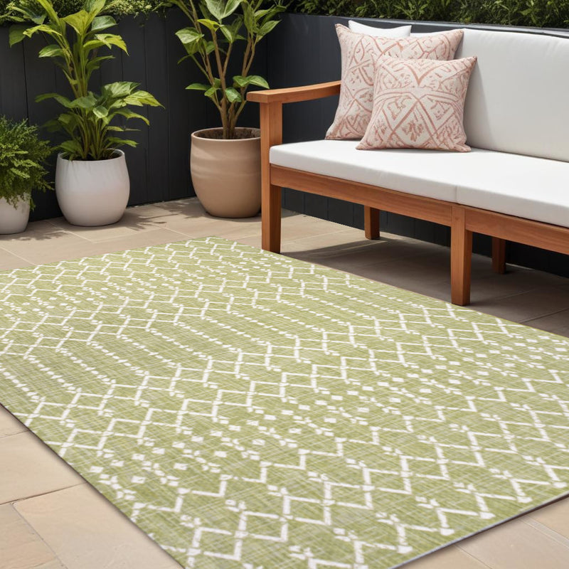 Light green trellis area rug with cream geometric pattern, indoor/outdoor