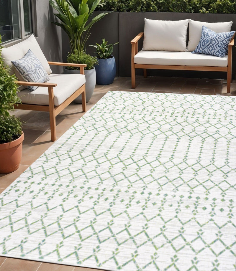 Rectangular ivory area rug with green trellis diamond pattern for outdoor use