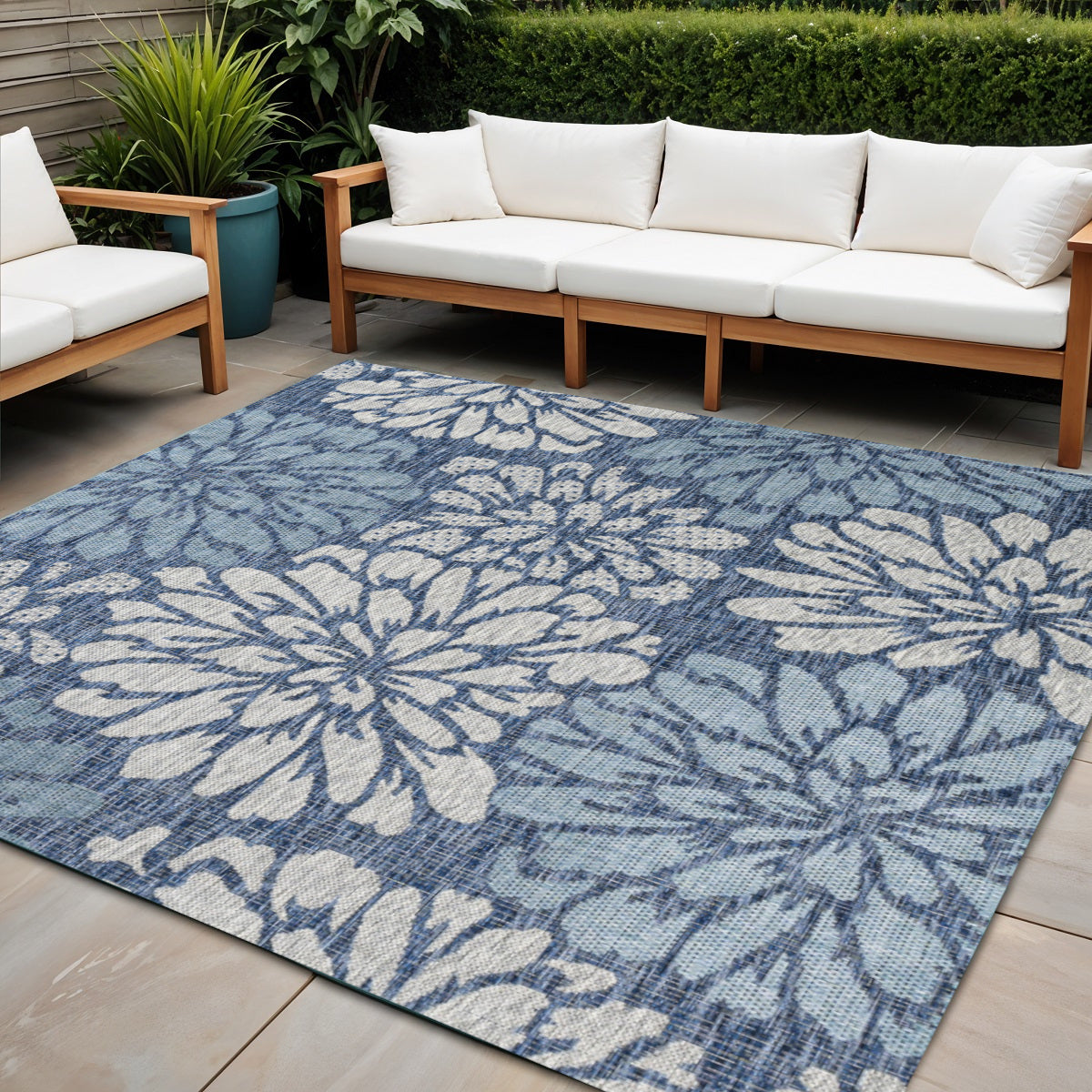 Indoor/outdoor rug with blue floral medallion pattern and cream accents