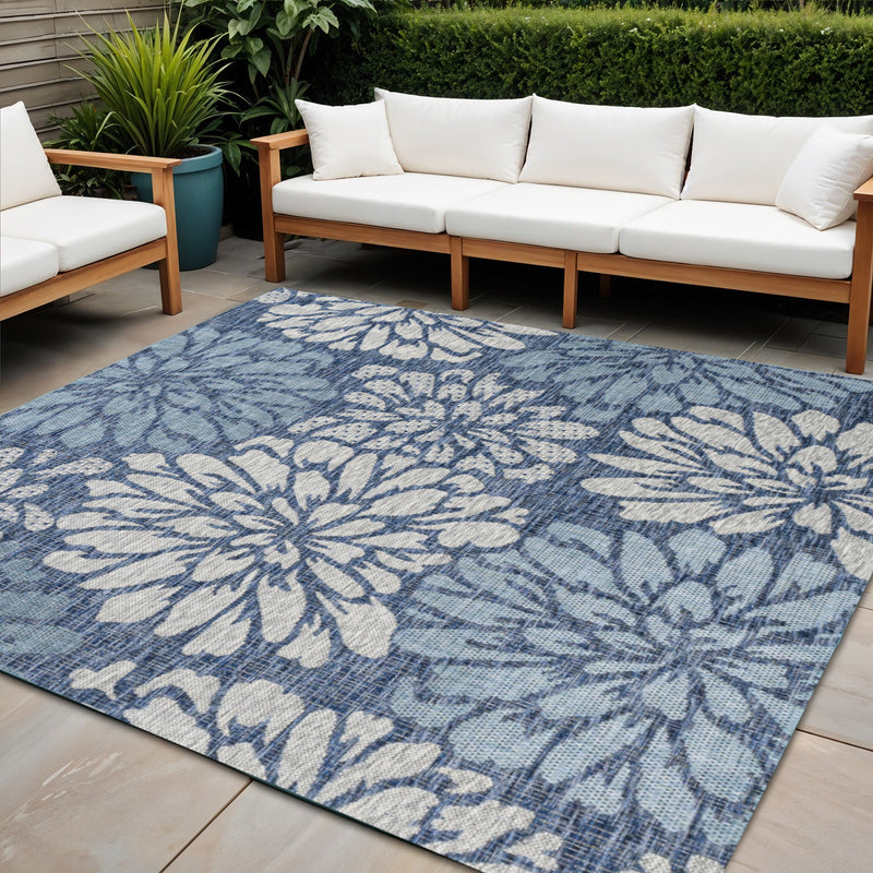 Indoor/outdoor rug with blue floral medallion pattern and cream accents