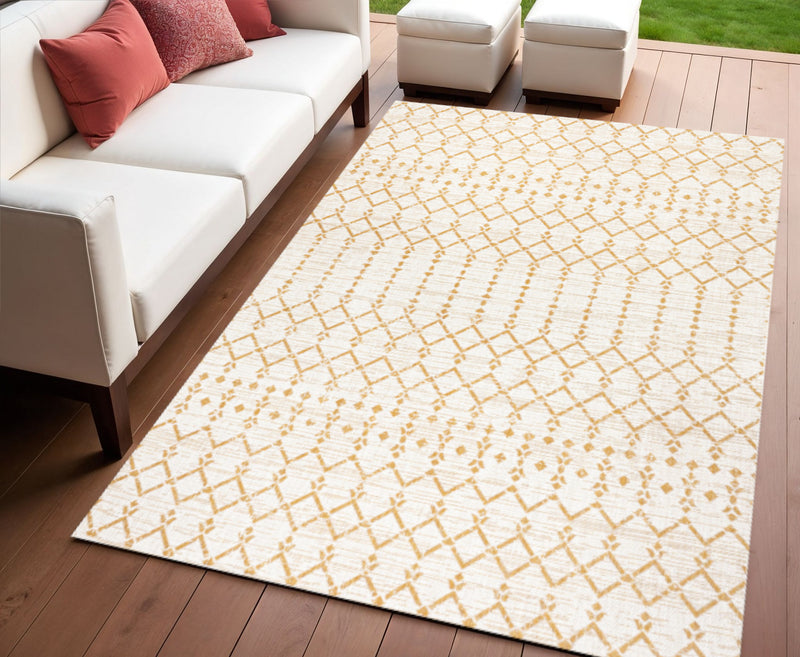Cream and yellow trellis area rug with geometric diamond pattern in indoor setting