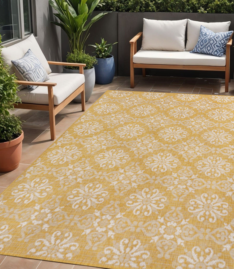 Yellow and cream damask floral indoor outdoor area rug, wide pattern view