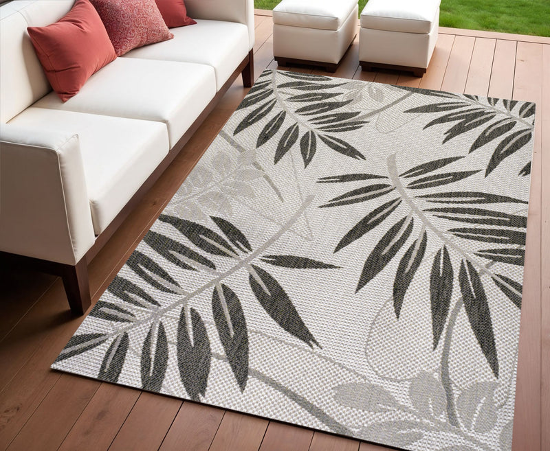 Gray and black leaf floral area rug with subtle woven texture