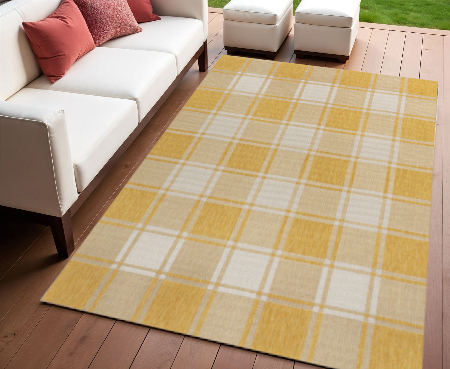 Yellow and cream gingham area rug with plaid grid, on hardwood floor.