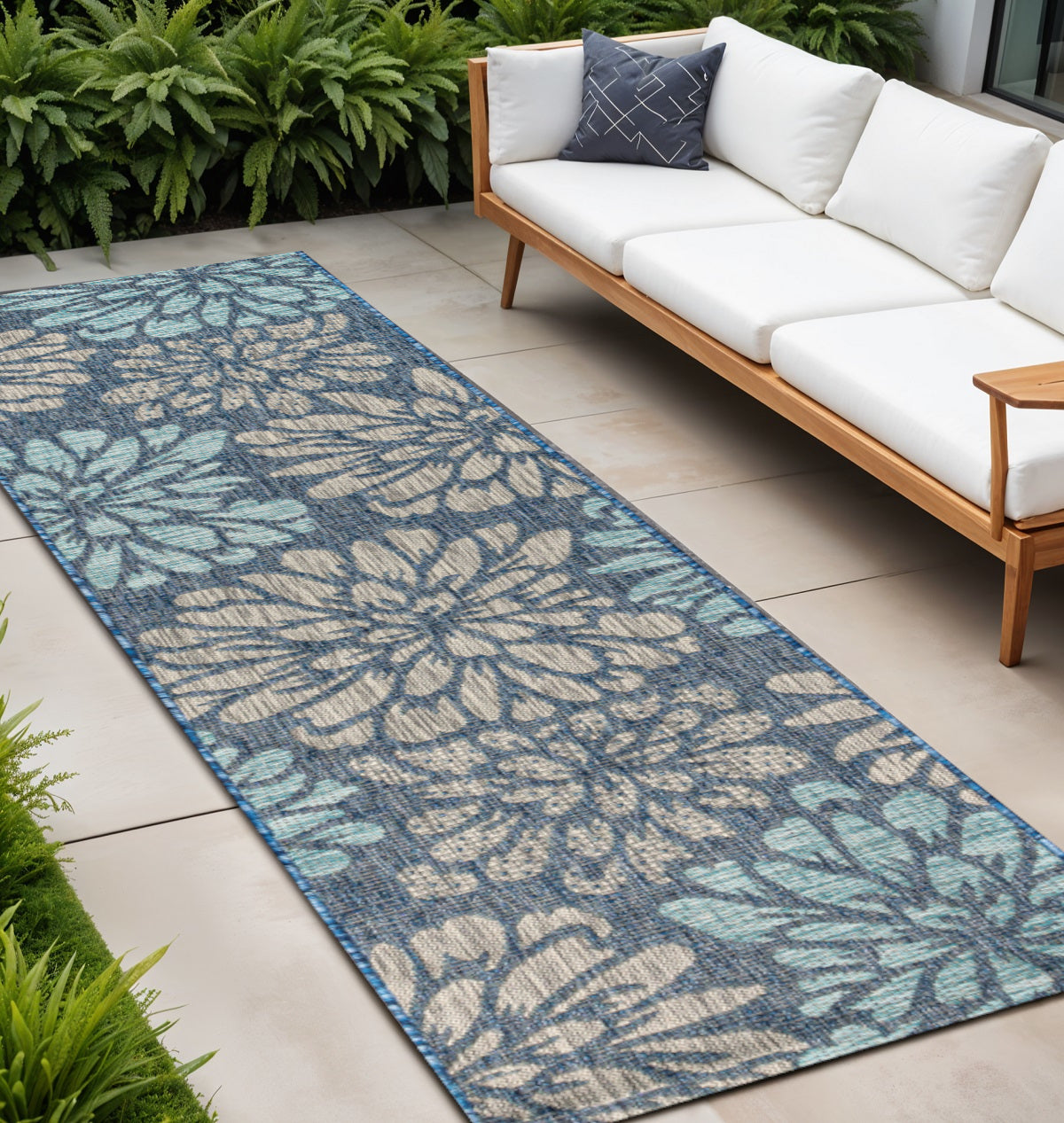 Navy and aqua floral indoor/outdoor runner rug with textured weave and border