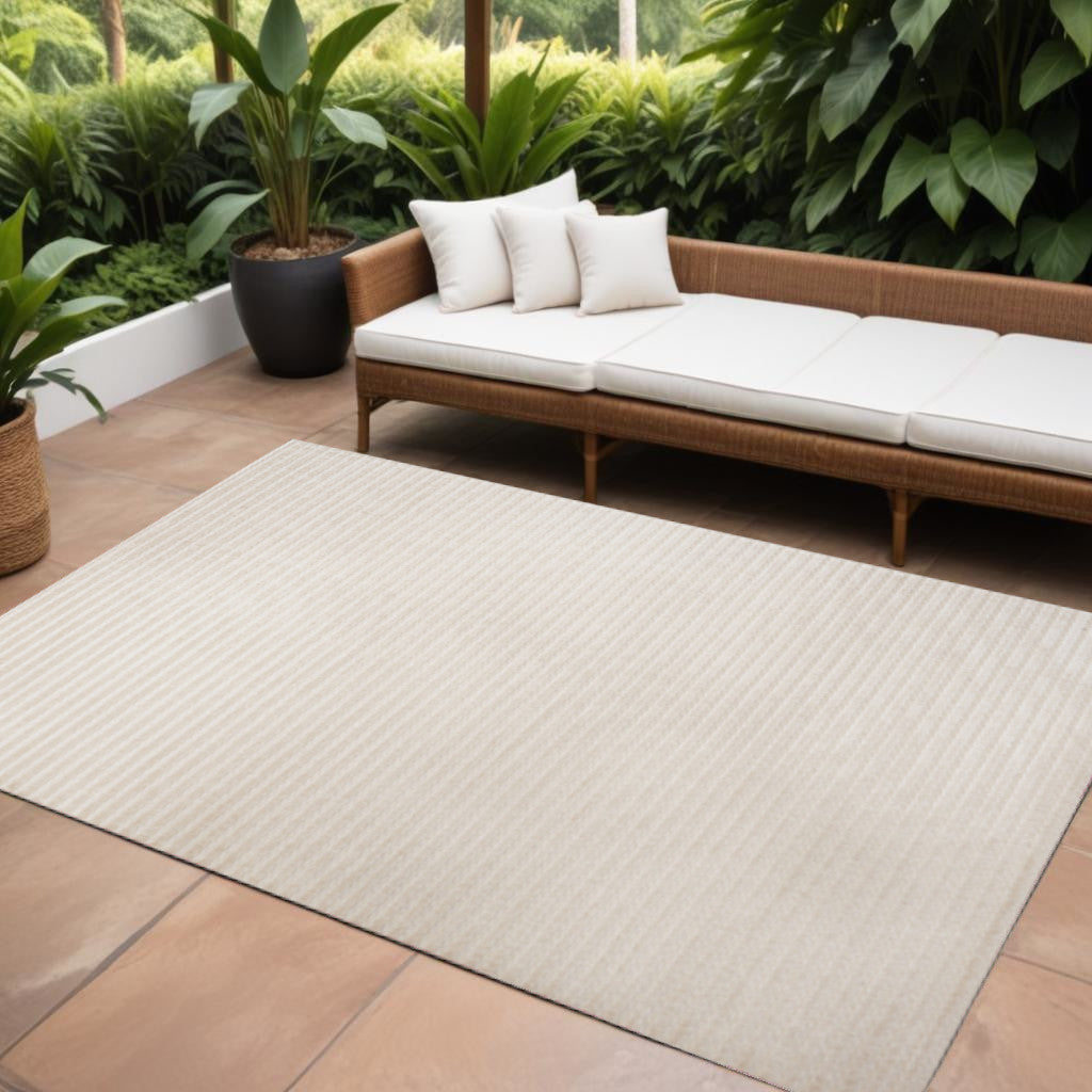 Ivory and cream striped indoor/outdoor area rug, rectangular 10 x 14 ft
