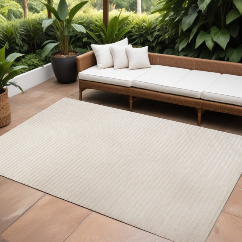 Ivory and cream striped indoor/outdoor area rug, rectangular 10 x 14 ft