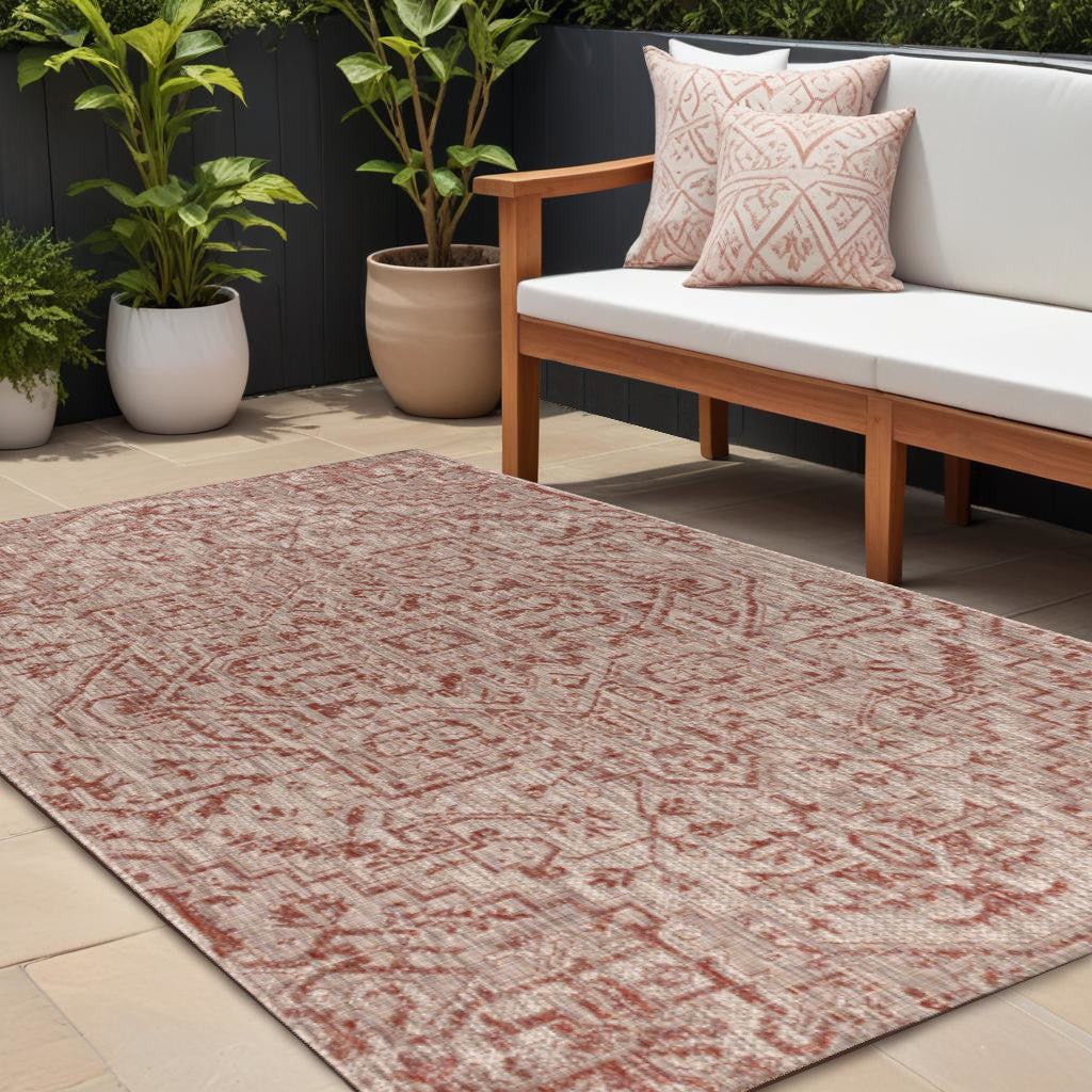 Red and taupe medallion area rug with ornate pattern for indoor or outdoor