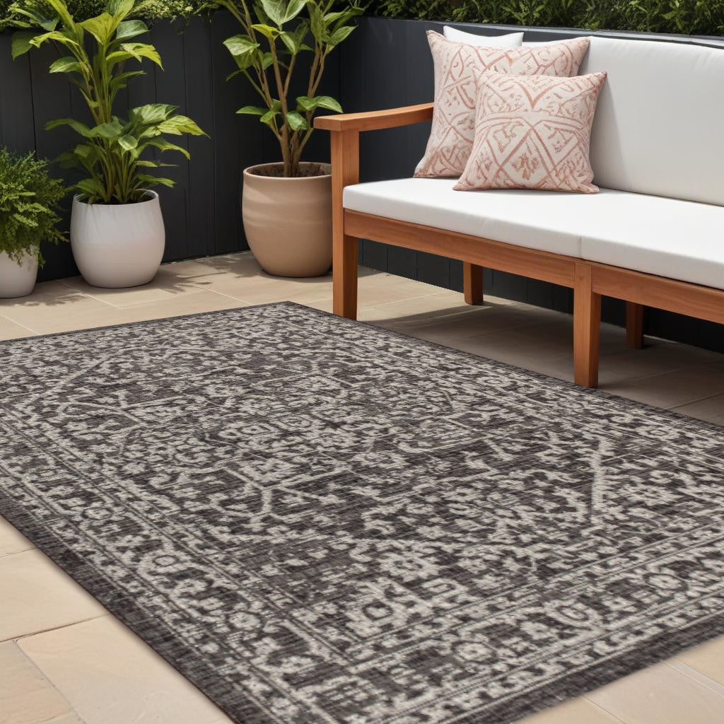 Black and gray medallion area rug with ornate pattern