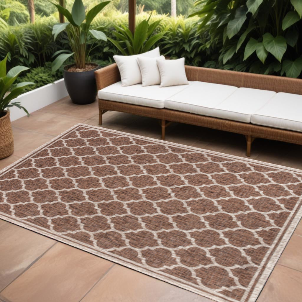 Indoor-outdoor area rug with espresso-brown and taupe geometric lattice pattern