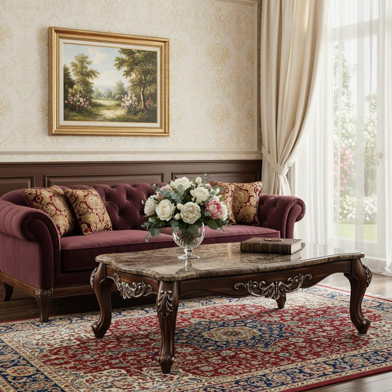 Brown faux marble coffee table with ornate carved apron and turned legs