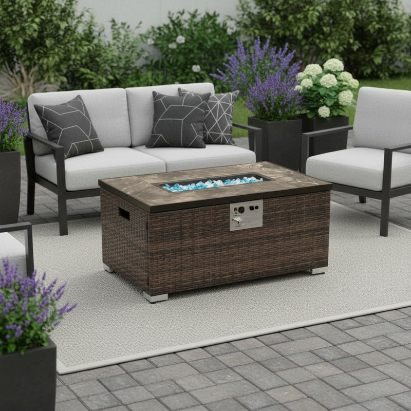 Brown rattan propane fire pit table with stone top, glass flame bed, and control panel