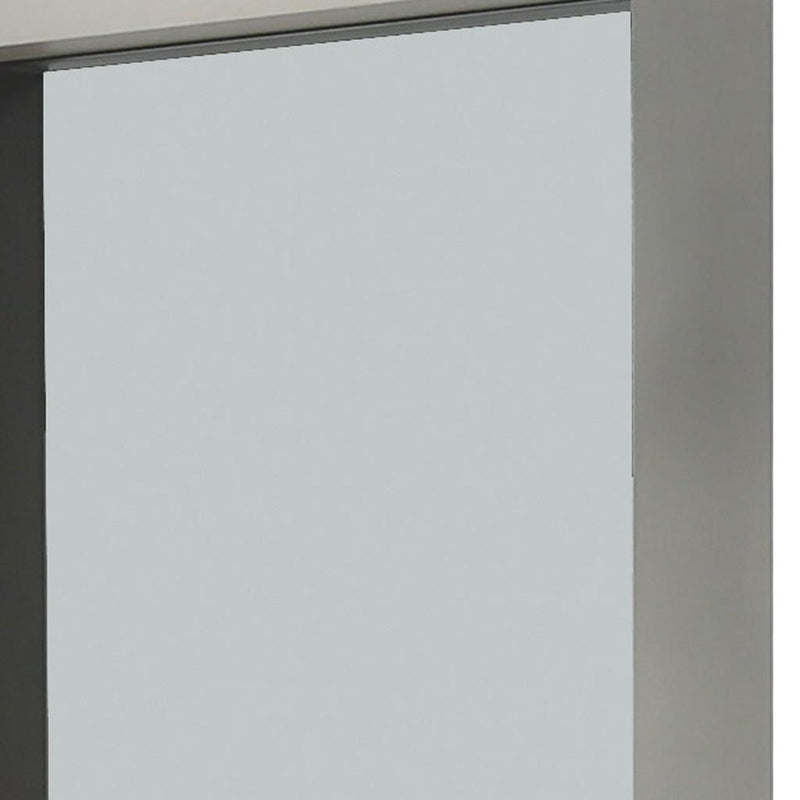 Close-up of silver mirror frame edge and corners around reflective glass panel