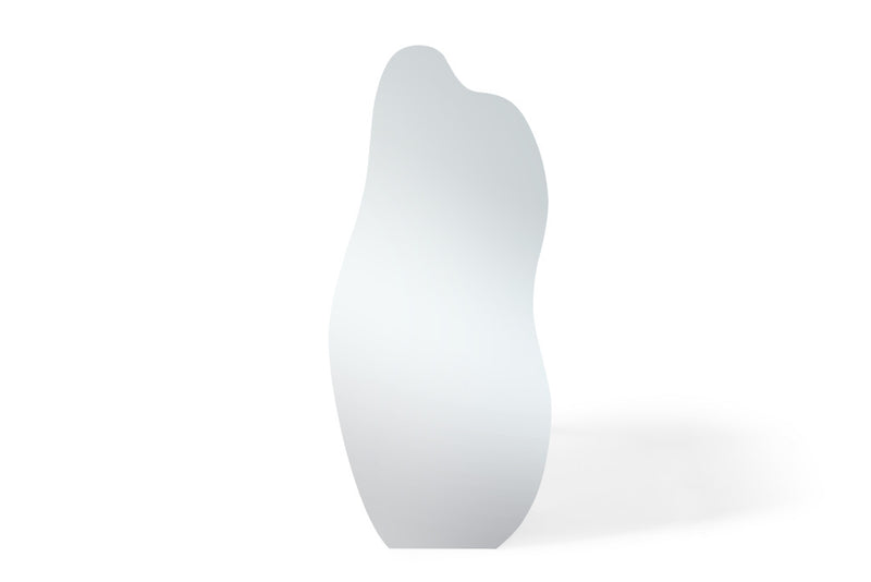 Clear abstract frameless mirror with tall wavy arched silhouette, freestanding