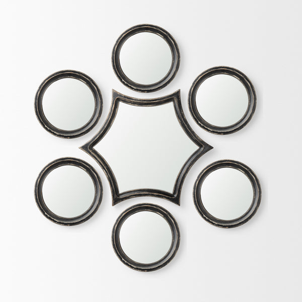 Set of seven accent mirrors with round frames and a star-shaped center panel